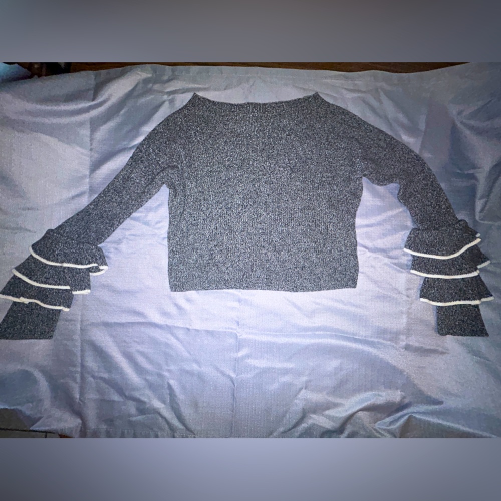 Express size Medium sweater. Ruffle arms. Used
